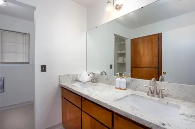 a bathroom with a sink and a mirror at Serene Riverfront Home - 150 yds from the River in Three Rivers