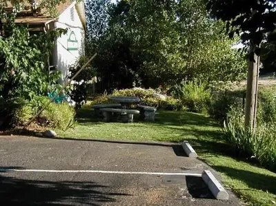 a picnic table and a picnic table in a yard at colfax motorlodge in Colfax