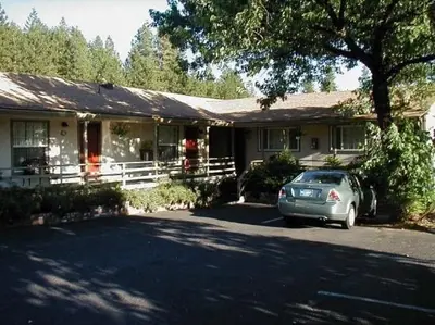 a house with a car parked in front of it at colfax motorlodge in Colfax