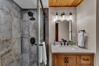 a bathroom with a shower and a sink at Laid-Back Tahoe Stay Walk to Lake & EV Charger in Homewood