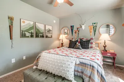 a bedroom with a bed and two lamps at Hike, Swim and Golf Home Near Dtwn Twain Harte in Twain Harte