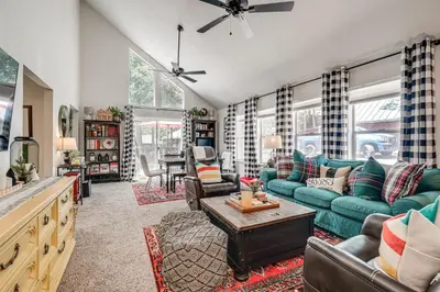 a living room with a green couch and chairs at Hike, Swim and Golf Home Near Dtwn Twain Harte in Twain Harte