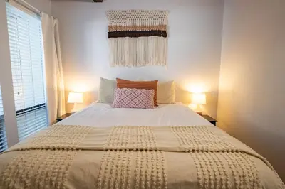 a large bed in a bedroom with two lamps at 2xKing, Balconies, 350mbps. Loft, Near Northstar in Kings Beach