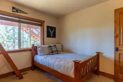 a bedroom with a bed and a window at Kings Beach Family Retreat - Lake Views and Hot Tub in Kings Beach