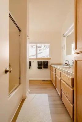 a bathroom with a sink and a mirror at Walk to Palisades Village Pet Friendly 2BR Chalet in Olympic Valley