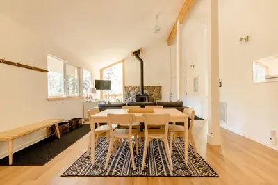 a dining room with a table and chairs at Walk to Palisades Village Pet Friendly 2BR Chalet in Olympic Valley