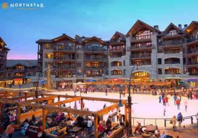 a large building with a skating rink in front of it at Family Escape Minutes to Northstar EV Charger WandD in Truckee