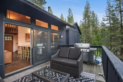a black tiny house with a grill on a deck at Idyllic Incline Village close to Lake Tahoe in Incline Village