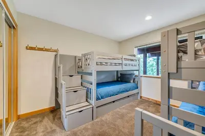 a bedroom with bunk beds in a house at Chestnut Haus at Tahoe Donner By Tahoe Getaways - 4 BR w HOA Amenities in Truckee