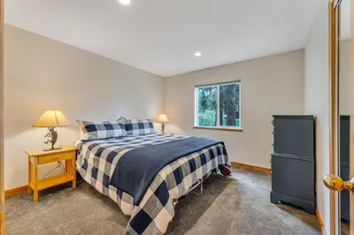 a bedroom with a bed and a window at Chestnut Haus at Tahoe Donner By Tahoe Getaways - 4 BR w HOA Amenities in Truckee