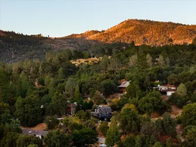 a house in the middle of a forest at Modern A Frame,20min Yosemite,Sunset View, PetOkay in Oakhurst