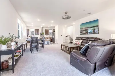 a living room with a couch and a table at Spacious 4BR-3BA Cozy and Modern in Elk Grove in Elk Grove