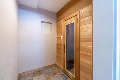 a hallway with a door in a room with wood at Tranquil Stay Sauna, Rooftop and Nature Views in Incline Village