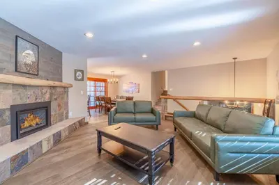 a living room with a couch and a fireplace at Tranquil Stay Sauna, Rooftop and Nature Views in Incline Village