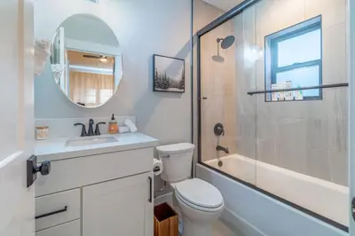 a bathroom with a toilet and a sink and a shower at Elegant Tahoe Escape Comfort and Style Combined in Glenbrook