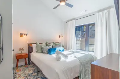 a bedroom with a bed and a window at Elegant Tahoe Escape Comfort and Style Combined in Glenbrook