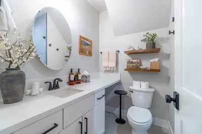 a bathroom with a sink and a toilet and a mirror at Elegant Tahoe Escape Comfort and Style Combined in Glenbrook