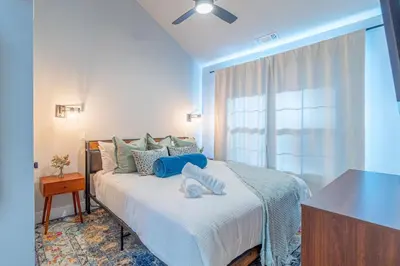 a bedroom with a large bed with a window at Elegant Tahoe Escape Comfort and Style Combined in Glenbrook
