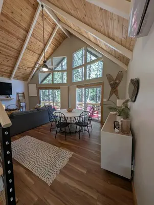 a living room with a table and chairs at Mountain Haven Near Kirkwood Resort! in Pioneer