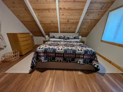a bedroom with a bed and a wooden ceiling at Mountain Haven Near Kirkwood Resort! in Pioneer
