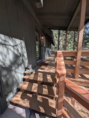 a wooden bench on a porch of a house at Mountain Haven Near Kirkwood Resort! in Pioneer