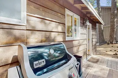 a front view of a car parked next to a house at The Bear's Den in South Lake Tahoe
