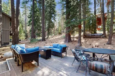 a patio with furniture and a table and chairs at The Bear's Den in South Lake Tahoe