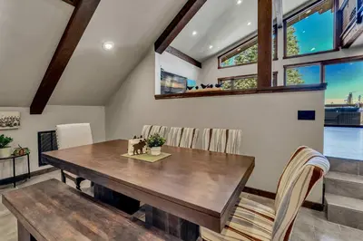 a dining room with a wooden table and chairs at Agate Bay Getaway with Lake Views in Carnelian Bay