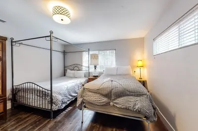 a bedroom with a bed with a canopy bed at Meadows Crossings in South Lake Tahoe