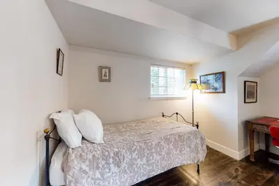a bedroom with a bed and a window at Meadows Crossings in South Lake Tahoe