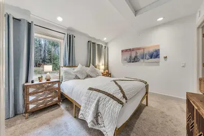 a bedroom with a bed and a window at Homewood Hideaway Family Friendly plus EV Charger in Homewood