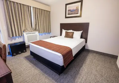 a bedroom with a large bed in a hotel room at Stovepipe Wells Village in Death Valley