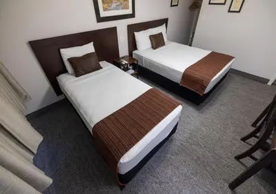 a hotel room with two beds in a room at Stovepipe Wells Village in Death Valley