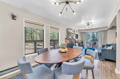 a living room with a wooden table and chairs at Modern Incline Village Escape Near Lake and Trails in Incline Village