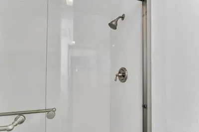 a shower with a glass door with a shower head at Modern Incline Village Escape Near Lake and Trails in Incline Village