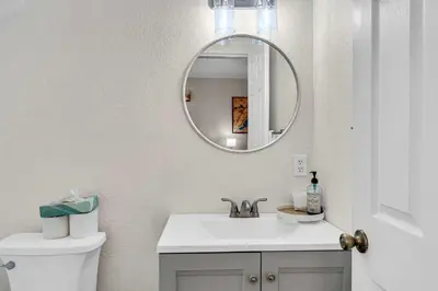 a white bathroom with a sink and a mirror at Modern Incline Village Escape Near Lake and Trails in Incline Village