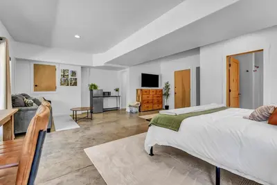 a bedroom with a bed and a living room at New Listing! North Fork Hideaway Sleeps 14! in Three Rivers