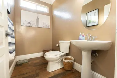 a bathroom with a toilet and a sink at Private room--Ideal for working professionals-- in Tulare