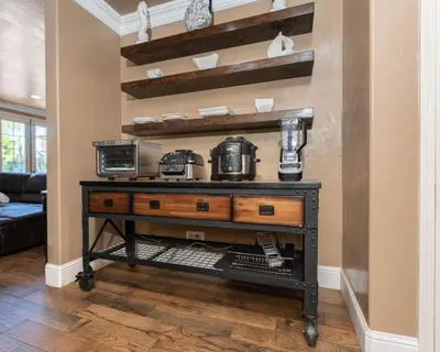a room with a table with two coffee machines on it at Private room--Ideal for working professionals-- in Tulare