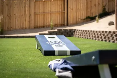a ping pong table sitting on the grass at The Deco Retreat - UNR - Pet Friendly in Reno