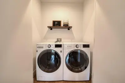 a laundry room with a washer and dryer at Twilight Run at Palisades by Tahoe Getaways - Pet-Friendly 3BR w EV Charger & Ski Shuttle in Olympic Valley