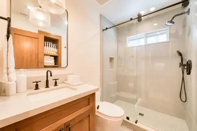 a bathroom with a shower and a toilet and a sink at Splendid at Chamberlands by Tahoe Getaways - Chamberlands HOA, Private Hot Tub & Walk to Lake Tahoe in Tahoma
