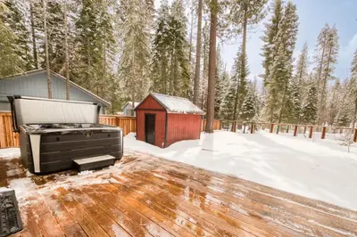 a snow covered deck with a grill and ashed at Splendid at Chamberlands by Tahoe Getaways - Chamberlands HOA, Private Hot Tub & Walk to Lake Tahoe in Tahoma