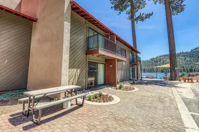 a building with a bench and a patio at Beautiful Studio W/Kitchenette #134 at Donner Lake Village in Truckee