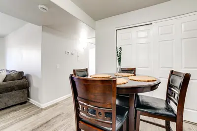 a dining room with a table and chairs at 3 Mi to Dtwn Gated Condo with Patio in Reno! in Reno
