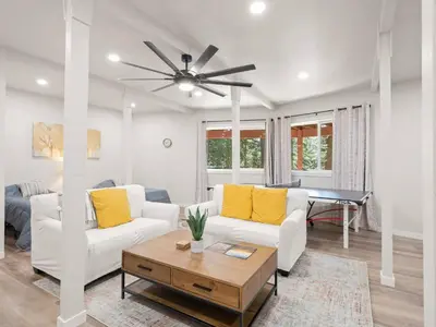 a living room with two white couches and a table at Mountain retreat w FirePit, BBQ, Karaoke, PingPong in Arnold