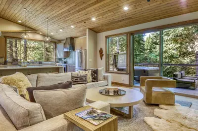 a living room with a couch and a table at The Lodge at Silverado in Tahoe City