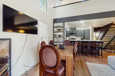 a dining room and kitchen with a table and chairs at Cozy Bear Retreat in Kings Beach