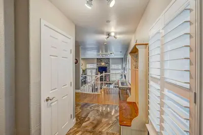 a hallway with a white door leading to a living room at Marina Escape-Lake-Family-Fishing-Casino in Sparks