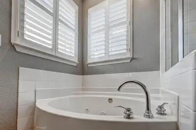 a bathroom with a tub and a window and a sink at Marina Escape-Lake-Family-Fishing-Casino in Sparks